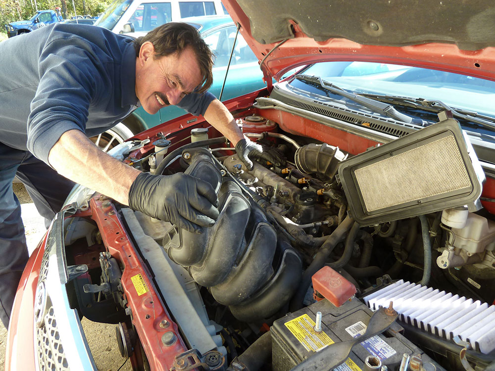 Auto Tech mechanic performing maintenance